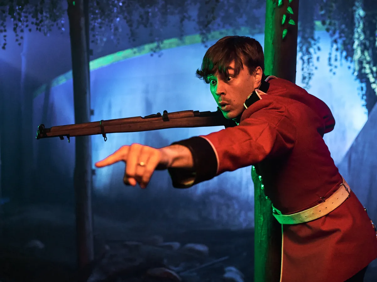 Man With Rifle Pointing